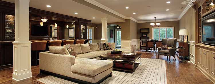 Large white basement with a white couch
